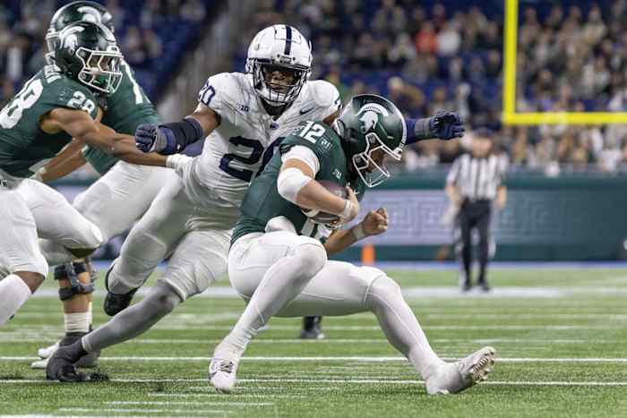 Nov 24, 2023; Detroit, Michigan, USA; Penn State Nittany Lions defensive end Adisa Isaac (20) pressures and sacks Michigan State Spartans quarterback Katin Houser (12) during the second half at Ford Field. Mandatory Credit: David Reginek-USA TODAY Sports  